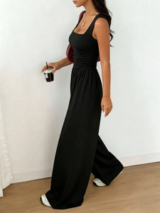 Detail of ruched waist design on black sleeveless wide leg jumpsuit for women