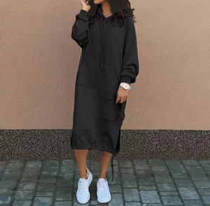 Detail of a black longline hoodie dress with side slits and a kangaroo pocket design