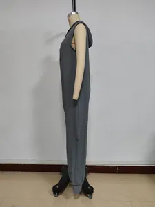 Detailed side view of a gray sleeveless hooded jumpsuit with button details and cuffs