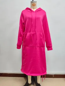Detail of hot pink oversized hoodie dress with kangaroo pocket and drawstring hood