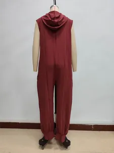 Detailed back view of dark red hooded sleeveless jumpsuit with button and tapered cuffs