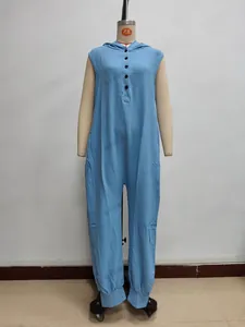 Close-up of sky blue sleeveless hooded jumpsuit with button detail and pleated texture