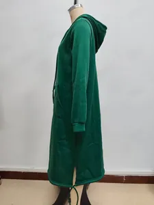 Detail of dark green oversized hoodie with side split hem and adjustable drawstrings