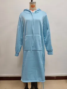 Detail of light blue oversized hoodie dress featuring a drawstring hood and kangaroo pocket