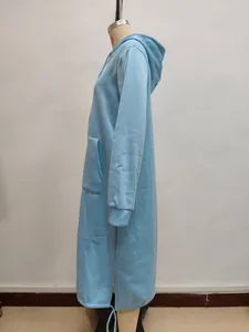 Detail view of oversized light blue hoodie with side split hem and large pockets