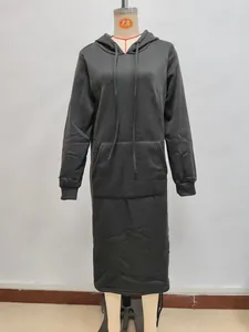 Detail of a black longline hoodie dress featuring a front kangaroo pocket and drawstrings