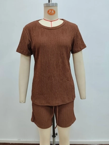 Detailed view of brown pleated texture fabric on short sleeve t-shirt and shorts set