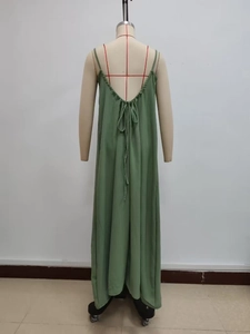 Detail of green backless maxi dress with deep V-cut and self-tie closure design