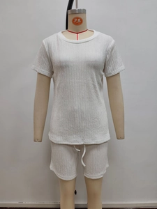 Detail of white two-piece lounge set showing unique ripple texture fabric on a mannequin