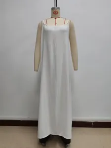 Detail of a white sleeveless slip dress featuring a minimalist round neck and long loose fit