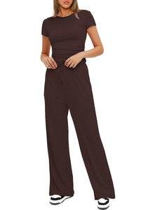 Detail view of the drawstring high waist and fabric texture on dark brown trousers