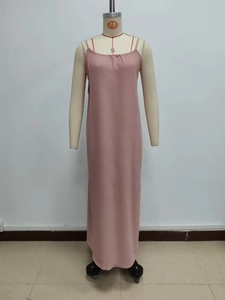 Detail view of pink strap maxi dress showing crinkle texture fabric on mannequin