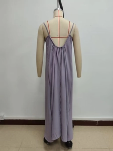 Detail of elegant backless lavender maxi dress with tiered pleats and flowing silhouette