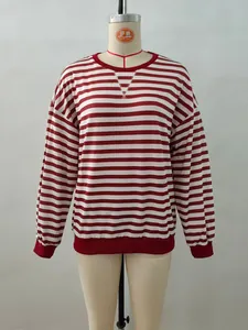 Detail of red and white striped sweatshirt showing rib cuffs and neck V-stitch detail