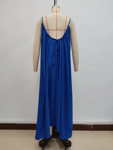 Detail view of Klein blue backless dress featuring a deep V-back with adjustable tie strings