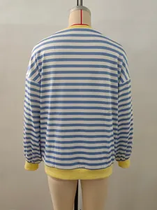 Detail of the blue and white striped sweatshirt with yellow ribbed cuffs and neckline