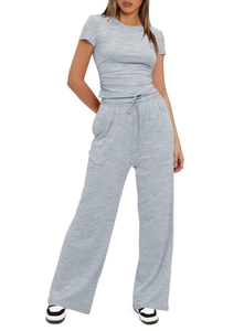 Detail of grey casual two-piece set featuring pleated waist top and drawstring wide pants