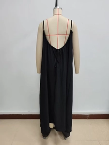 Detail of the elegant open-back design and thin straps on this black backless maxi dress