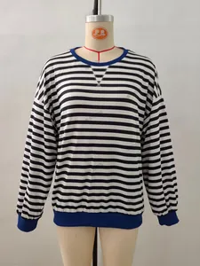 Detail of crewneck striped shirt with blue ribbed collar and V-stitch neckline embroidery