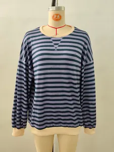 Detail shot of the purple and black striped crewneck sweatshirt with beige ribbed cuffs