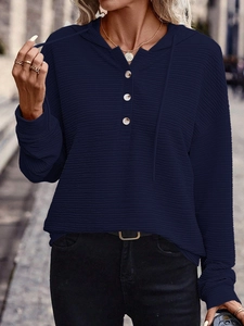 Navy blue waffle knit hoodie with henley neckline and adjustable drawstrings for women