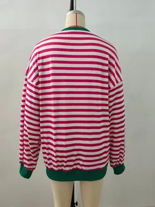 Detail of red and white striped long sleeve top with green ribbed neckline and cuffs