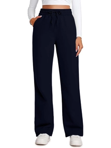 Detail view of navy blue wide-leg sweatpants featuring adjustable drawstring elastic waist