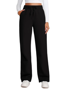 Detail of high-waisted wide-leg sweatpants featuring elastic drawstring and side pockets