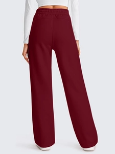 Rear view of burgundy high-waisted wide-leg sweatpants with elastic drawstring waistband