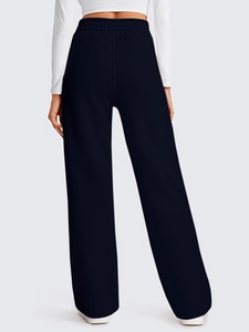 Rear view of high-waisted wide-leg sweatpants showing elastic waistband and drape