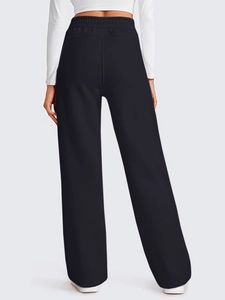 Detail shot of high-waist elastic drawstring on black wide-leg joggers for women