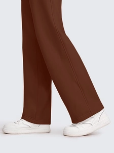 Detail view of coffee brown wide leg pants showing straight cut and flat hem