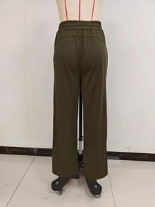 Detail view of military green high-waisted wide-leg sweatpants back with elastic waistband