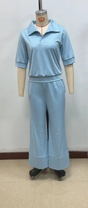 Detail of light blue two-piece lounge set with short sleeve top and wide leg pants