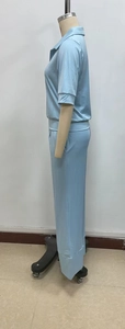 Detail view of light blue lounge set featuring a polo collar top and wide-leg trousers