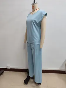 Close-up of light blue two-piece lounge set featuring sleeveless top and wide-leg pants