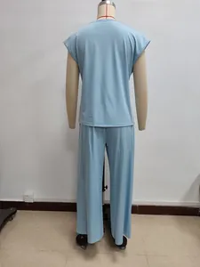 Detail view of light blue two-piece lounge set with crewneck top and wide-leg pants