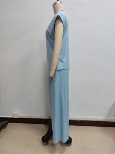 Detailed side view of light blue sleeveless top and wide-leg pants set in soft fabric