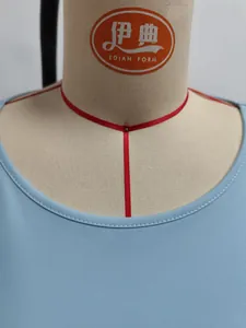 Detail view of reinforced crew neck stitching on light blue casual sleeveless top