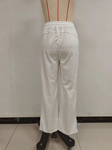 Detail of high-waist elastic waistband on white wide-leg loose lounge pants