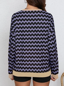 Back view of wave pattern colorblock sweatshirt with ribbed khaki cuffs and collar