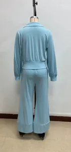 Detail view of the back of a light blue long-sleeved top and wide-leg trousers lounge set