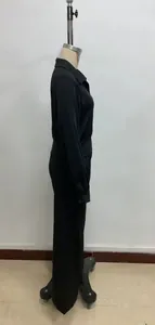 Side view of black long sleeve lapel top and wide-leg pants on a mannequin