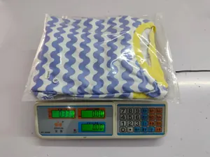Detail showing wave pattern sweatshirt weight 0.33kg and size S label in package