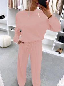 Detail of pink loungewear set with drawstring pants and long sleeve top in soft knit