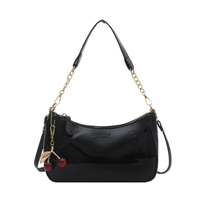 Glossy black patent leather underarm bag with chain strap and red cherry charm decor