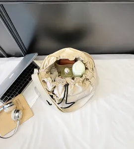 Detailed internal view of spacious nylon bucket bag with drawstring and daily essentials