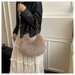 Chic light brown faux fur crescent tote bag with vintage wooden bead handle detail