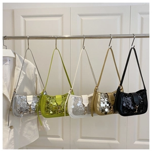 Detail view of five sequined shoulder bags in silver, green, white, gold and black