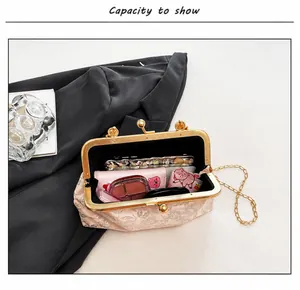 Interior view showing the capacity of this floral jacquard pink crossbody evening bag